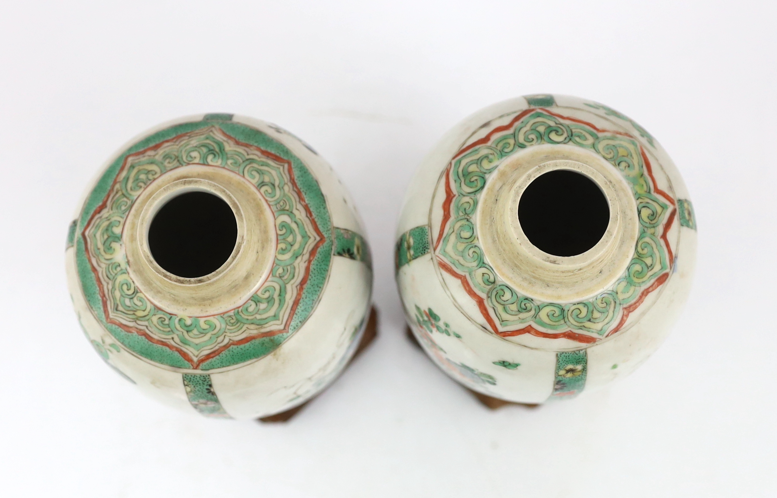 A near pair of Chinese famille verte jars, Kangxi period, on wood plinths, blue enamels repainted